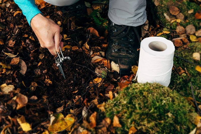 a-female-hiker-preparing-an-outdoor-toilet-stop